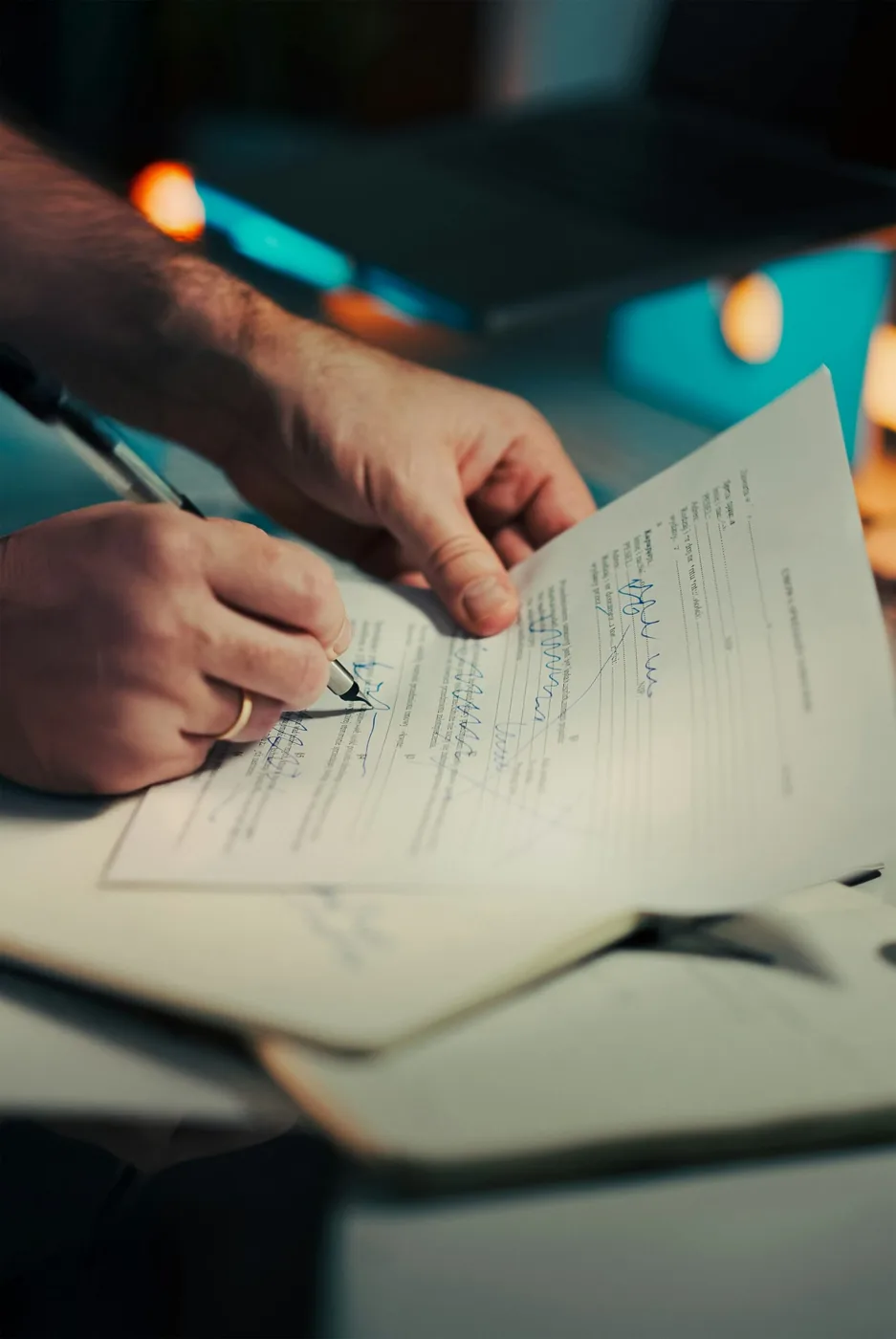 Business contract being signed with a fountain pen during a transaction