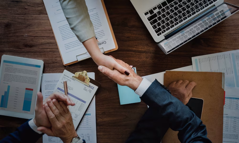 business-people-shaking-hands-together_53876-14816